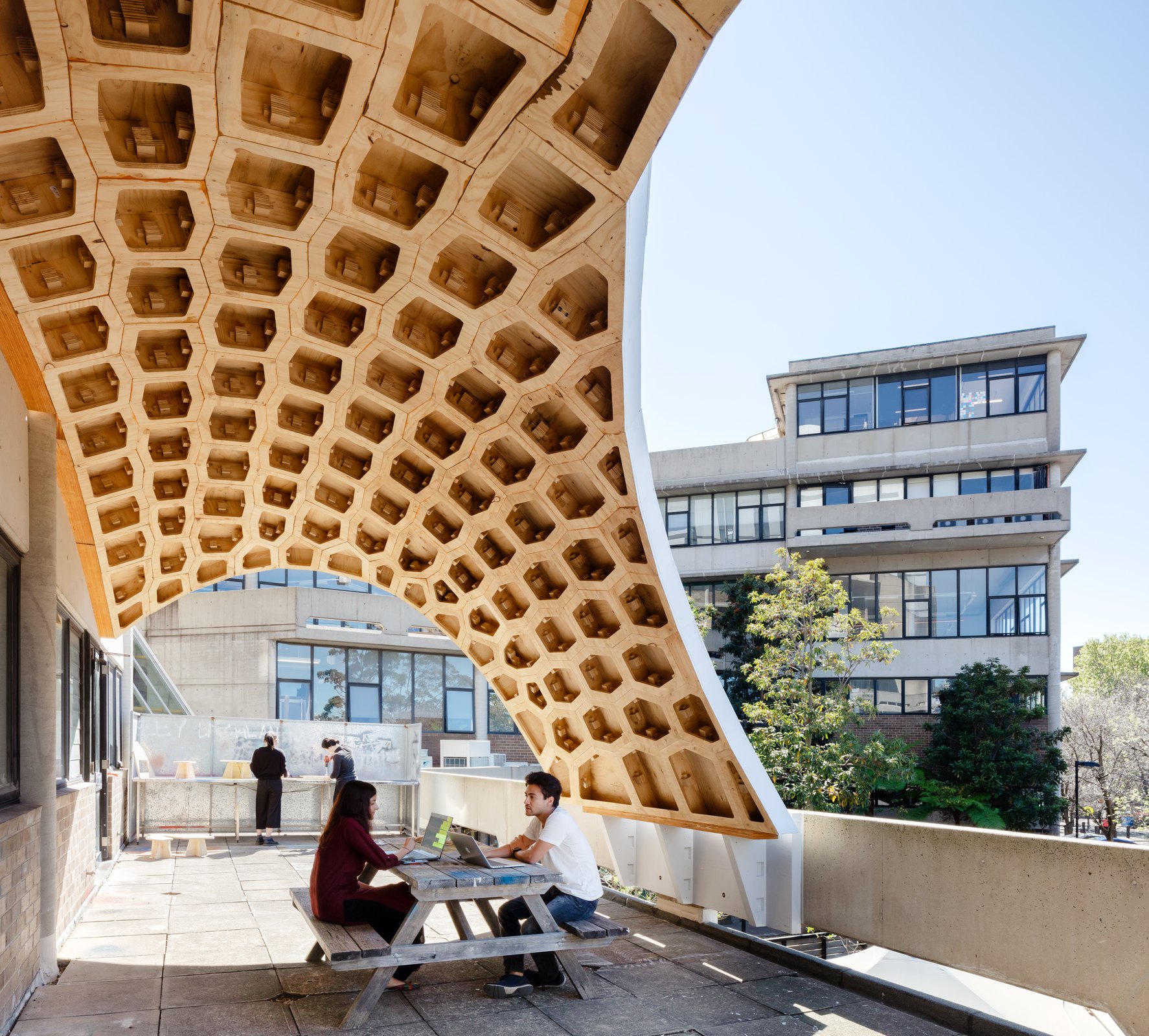 HexBox Canopy installed as a timber shell over a terrace.